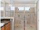 Modern tiled shower with glass enclosure and built in seating at 4911 Drawdy Ct, St Cloud, FL 34772