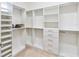 Walk-in closet with custom shelving and drawers at 4911 Drawdy Ct, St Cloud, FL 34772