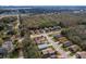 A high angle neighborhood aerial showing tree coverage and a clear view of neighborhood streets at 4941 Luna Negra Dr, Orlando, FL 32811