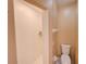 Bathroom featuring a standing shower, toilet, and neutral wall paint at 4941 Luna Negra Dr, Orlando, FL 32811