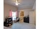 Bright bedroom featuring a desk, tile floors, and natural light streaming through the windows at 4941 Luna Negra Dr, Orlando, FL 32811