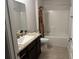 Bathroom featuring granite countertops and shower at 499 Meadow Pointe Dr, Haines City, FL 33844