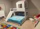 Charming bedroom with a unique bunk bed featuring a built in slide at 499 Meadow Pointe Dr, Haines City, FL 33844