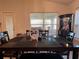 Formal dining area with a dark wood table and chairs, complemented by a decorative bar cabinet at 499 Meadow Pointe Dr, Haines City, FL 33844