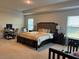 Primary bedroom with plenty of space for a king-size bed and home office at 499 Meadow Pointe Dr, Haines City, FL 33844