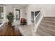 Inviting dining room with tile flooring, stairway, and natural light, perfect for Gathering gatherings at 5411 Oakgrain Ct, Davenport, FL 33837