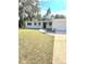 Lovely home featuring a well-kept lawn and concrete driveway at 5804 Viking Rd, Orlando, FL 32808