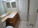 Bathroom with a corner vanity and a full mirror above the sink at 6028 Westgate Dr # 104, Orlando, FL 32835