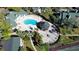 Overhead view of an inviting pool, hot tub, gazebo, and deck chairs nestled in a community gathering space at 6028 Westgate Dr # 104, Orlando, FL 32835