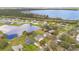 Aerial view of a lakeside community with beautiful homes and lush green lawns at 6301 Oak Shore Dr, St Cloud, FL 34771