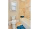 Bathroom featuring neutral-colored tile, a shower-tub combo, and granite countertops at 6301 Oak Shore Dr, St Cloud, FL 34771