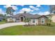 Charming stone accent home with well-manicured lawn and beautiful landscaping at 6301 Oak Shore Dr, St Cloud, FL 34771