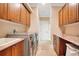 Bright laundry room with cabinets and modern washer and dryer at 6301 Oak Shore Dr, St Cloud, FL 34771