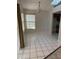 Bright dining area is enhanced by natural light from a window with tile flooring and a simple light fixture at 6356 Bennett Ct, St Cloud, FL 34771