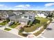 New two-story home featuring a brick driveway, attached two-car garage and manicured landscaping at 6699 Alder Rd, Harmony, FL 34773