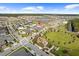 Aerial view of the community with parks, playgrounds, and a scenic pond at 6699 Alder Rd, Harmony, FL 34773