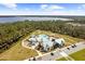 Aerial view of the community pool and amenities with lake in background at 6699 Alder Rd, Harmony, FL 34773