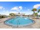 Beautiful community pool with sun loungers and a modern clubhouse at 6699 Alder Rd, Harmony, FL 34773