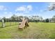 Community dog park with agility equipment, fencing, and ample green space for pets to enjoy at 6699 Alder Rd, Harmony, FL 34773