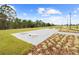 Community horseshoe pit area with landscaped surroundings and walking paths at 6699 Alder Rd, Harmony, FL 34773