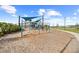 Community playground featuring swings, climbing structures, and covered seating areas for families at 6699 Alder Rd, Harmony, FL 34773