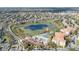 Aerial view of the community featuring homes, a lake, and a water park, highlighting nearby amenities at 7735 Teascone Blvd, Kissimmee, FL 34747