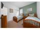 Charming bedroom featuring two twin beds with coastal-themed bedding and coordinated artwork at 7735 Teascone Blvd, Kissimmee, FL 34747