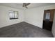 Empty room with tiled floor, a window, and a ceiling fan, ready for personalization at 832 Whalebone Bay Dr, Kissimmee, FL 34741