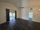 Bright and airy living room featuring luxury vinyl plank flooring and sliding glass door at 832 Whalebone Bay Dr, Kissimmee, FL 34741