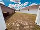 Large fenced backyard offers privacy and space for outdoor activities and entertaining at 881 Hudson Valley Dr, Kissimmee, FL 34759