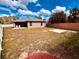 Spacious backyard with fenced-in yard, a covered lanai, and concrete slab at 881 Hudson Valley Dr, Kissimmee, FL 34759