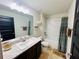 Well-lit bathroom with a large vanity and shower/tub combination at 881 Hudson Valley Dr, Kissimmee, FL 34759