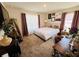 A comfortable bedroom with stylish decor, lots of space and natural light at 881 Hudson Valley Dr, Kissimmee, FL 34759