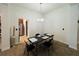 Cozy dining area featuring a chandelier and views into the kitchen at 881 Hudson Valley Dr, Kissimmee, FL 34759