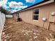 Home exterior with a manicured lawn, new windows, and energy-efficient AC unit at 881 Hudson Valley Dr, Kissimmee, FL 34759