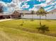 Well-maintained front yard with healthy green lawn and privacy fence in the background at 881 Hudson Valley Dr, Kissimmee, FL 34759