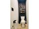 Stylishly decorated powder room with black accent wall and modern fixtures at 881 Hudson Valley Dr, Kissimmee, FL 34759