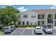 Inviting condo complex featuring well-manicured landscaping and convenient parking at 8824 Grand Palms Cir # A, Kissimmee, FL 34747