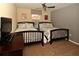 Bedroom features two beds with gray-patterned bedding and a dresser with a television at 8984 Cuban Palm Rd, Kissimmee, FL 34747