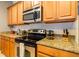 Well-equipped kitchen featuring stainless steel appliances and granite countertops at 8984 Cuban Palm Rd, Kissimmee, FL 34747