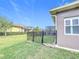 The view from the back corner of the house features the fenced in backyard and a peek at the pool area at 901 Shorehaven Dr, Poinciana, FL 34759