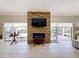 The living room includes an electric fireplace and a sliding door for indoor/outdoor living at 901 Shorehaven Dr, Poinciana, FL 34759