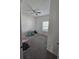 A basic bedroom with grey carpet and a window at 1046 Wanderer Dr, Deltona, FL 32738