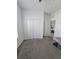 A simple bedroom with grey carpet and a closet at 1046 Wanderer Dr, Deltona, FL 32738