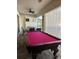 Spacious game room featuring a pool table and an outdoor seating area at 10902 Citron Oaks Dr, Orlando, FL 32836