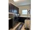 Well-equipped laundry area with a washer, dryer, storage, and tiled floor at 10902 Citron Oaks Dr, Orlando, FL 32836