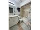 Well-maintained bathroom featuring updated vanity, mirror, bathtub, and neutral tile flooring at 113 Las Brisas Way, Kissimmee, FL 34743