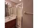 Bathroom featuring a glass enclosed shower, sink, and vanity at 119 Southampton Dr, Kissimmee, FL 34744