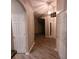 Hallway with wood floor and white doors that add brightness at 119 Southampton Dr, Kissimmee, FL 34744