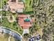 Aerial view highlighting the backyard pool, landscaping and brick drive and walkways at 1211 Aquila Loop, Kissimmee, FL 34747